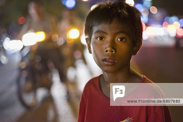 A Cambodian Begger Plys His Trade In The Middle Of A Busy Street  Phnom Penh Cambodia