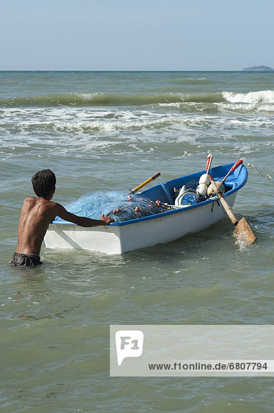 Man With His Rowing Boat At The Beach  Prachuap Thailand