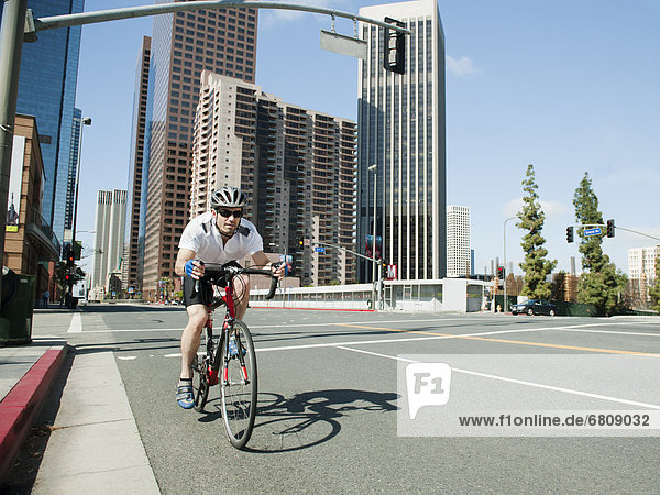 USA  California  Los Angeles  Young man road cycling on city street