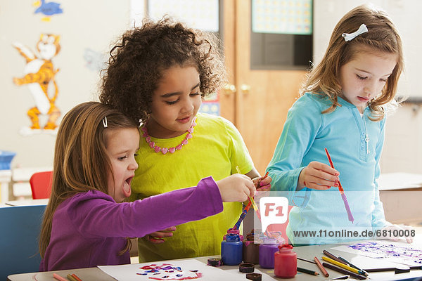 Children (2-3  4-5  6-7) during art classes