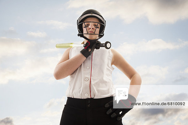 Portrait of girl (12-13) plying softball