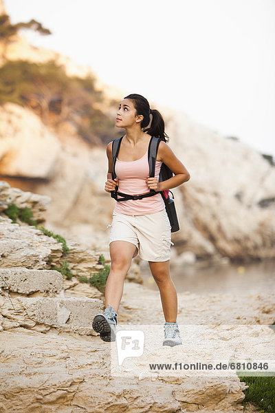 France  Marseille  Woman hiking in rocky terrain