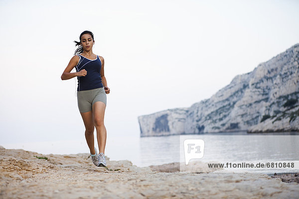 France  Marseille  Woman jogging by seaside