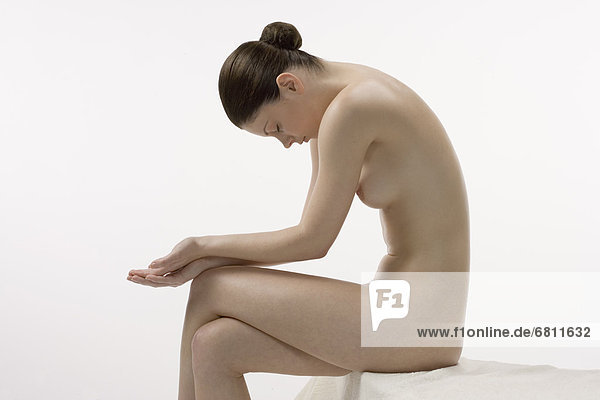 Female nude in sitting position