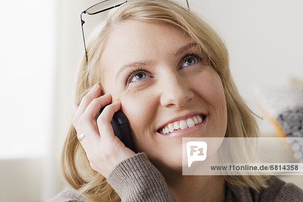 Portrait of smiling mid adult woman talking via mobile