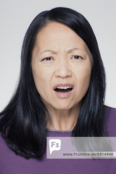 Studio portrait of mature woman with facial expression