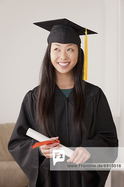 Portrait of graduated young woman