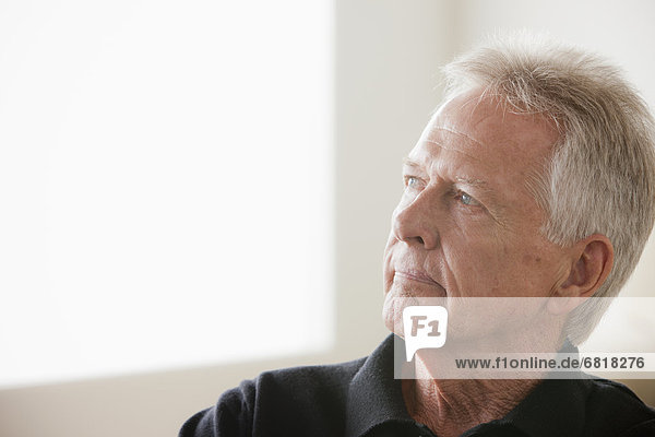 Portrait of thoughtful senior man