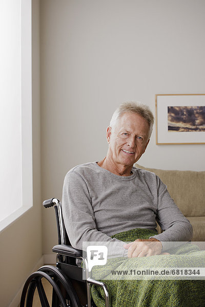 Portrait of senior man on wheelchair