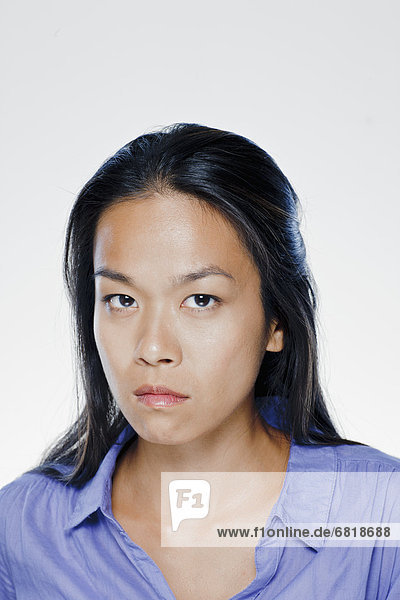 Portrait of angry young woman  studio shot