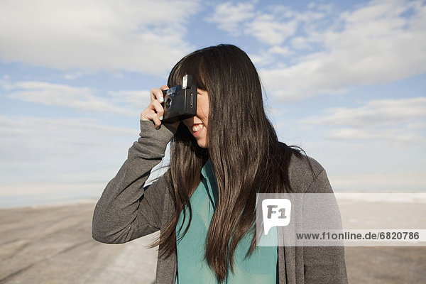 USA  Utah  Salt Lake City  Young woman taking photos