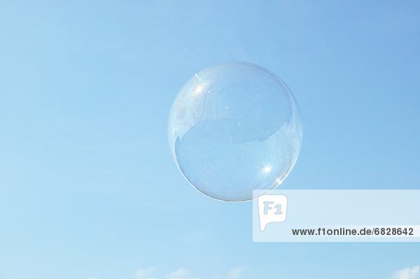 A single bubble floating in the sky