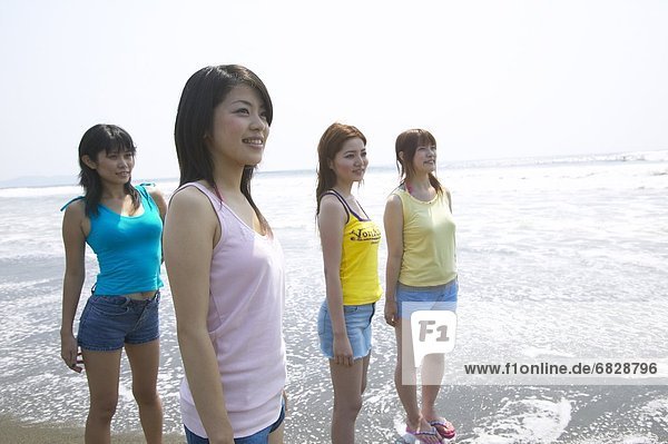 Four friends on the beach