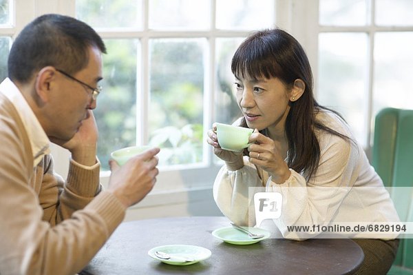 Couple drinking coffee together