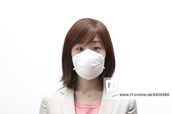 Businesswoman wearing a surgical mask