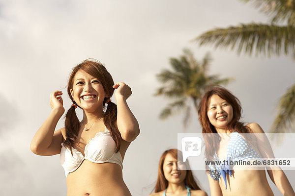 Young women standing in bikini  Guam  USA