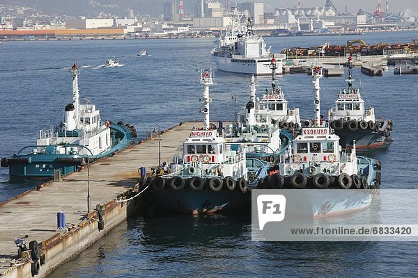 Tugboats anchored at Port of Kobe  Kobe city  Hyogo prefecture  Japan
