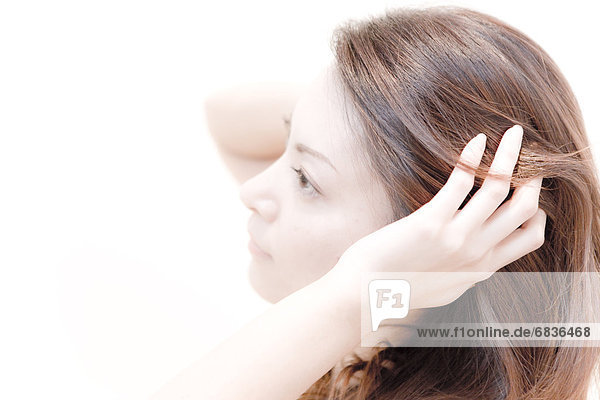Young Woman Running Her Hands Through Her Hair