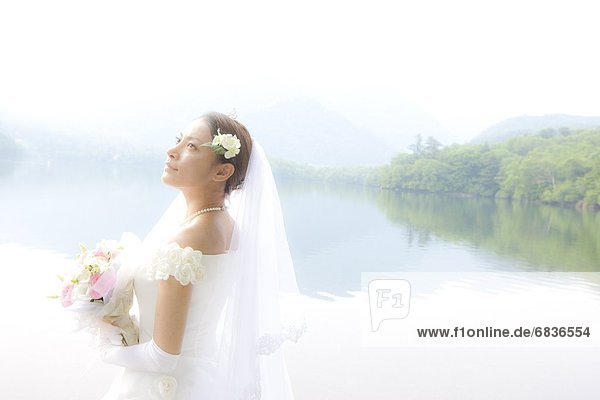 Bride in front of lake  Tochigi Prefecture  Honshu  Japan