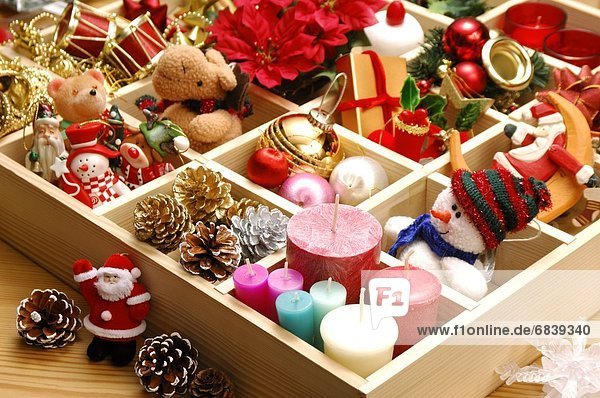Box of assorted Christmas decorations  toys and candles