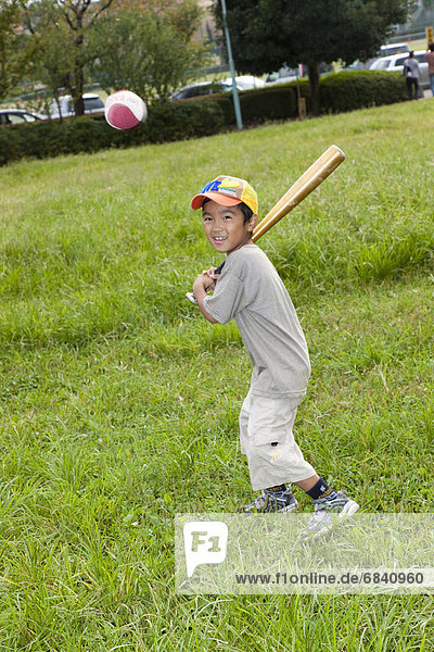 Boy playing baseball  Japan
