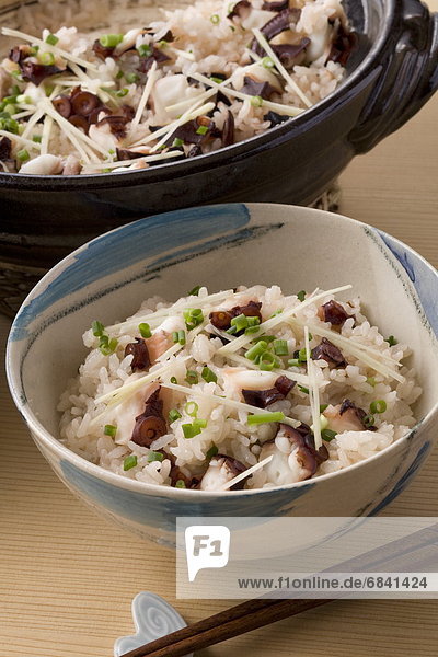 Bowl of rice cooked with slices of octopus