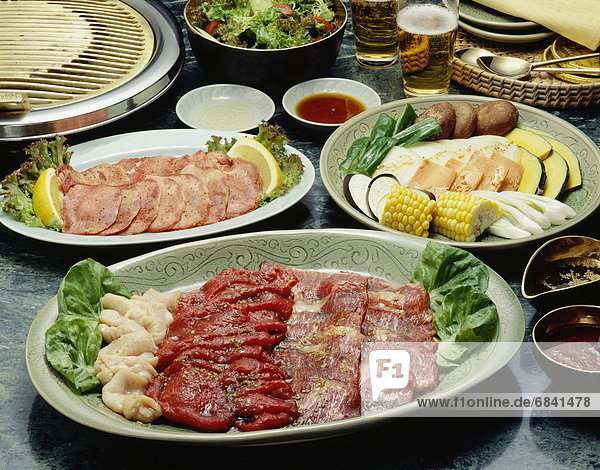 Sliced meat on plates