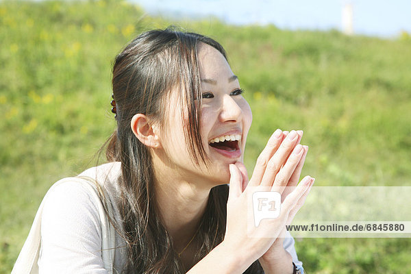 Young Woman Clapping Hands  Smiling