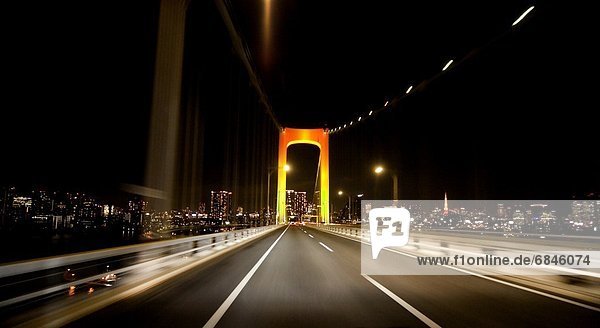 Car point of view of crossing the Rainbow Bridge at night. Tokyo Prefecture  Japan