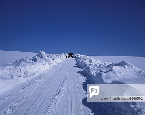 4x4 on a snow covered road  Furano  Hokkaido  Japan