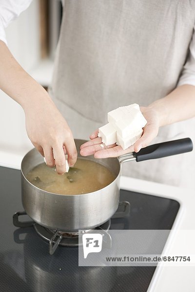 Person Making Miso Soup