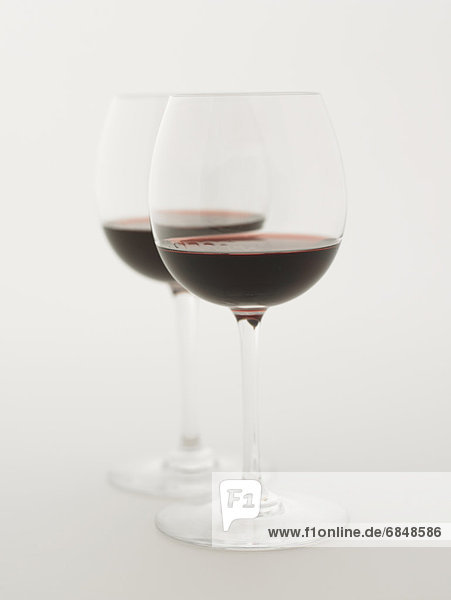 Glasses of red wine  white background