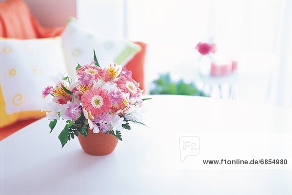 A Bouquet of Flowers on a Living Room Table