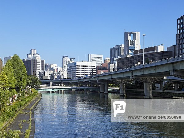 City With Bridge Over Water. Osaka Prefecture  Japan
