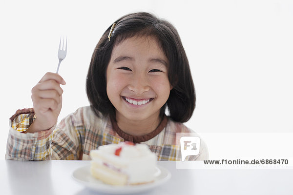Young Girl Eating Cake