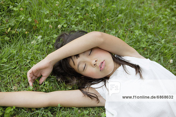 Girl Sleeping on Grass