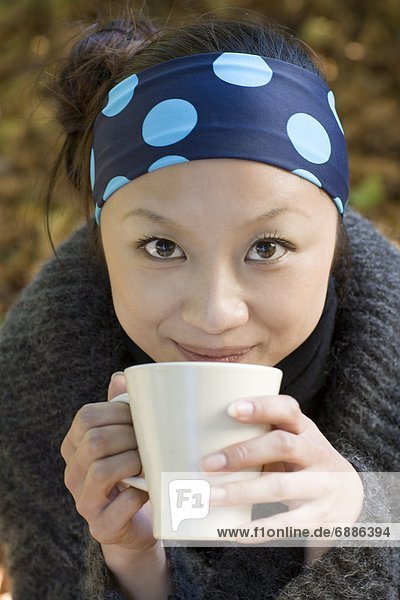 Portrait of Young Woman with Hot Drink