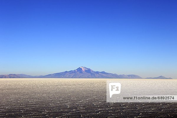 Salar de Uyuni salt flat and Mount Tunupa  Andes mountains in the distance in south-western Bolivia  South America