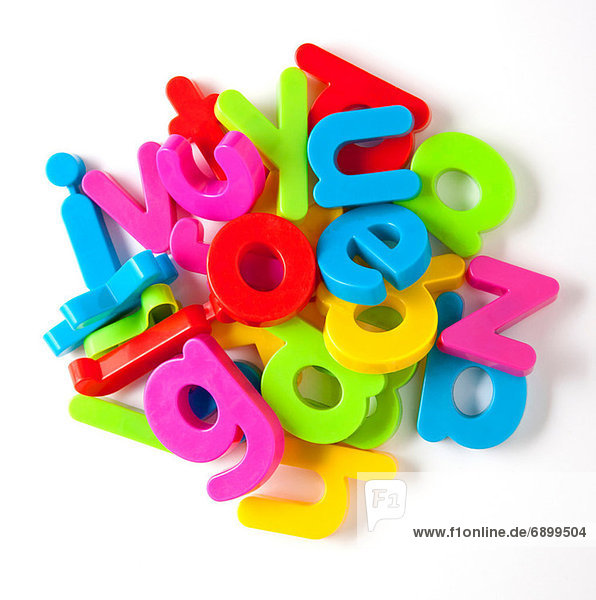 Alphabet fridge magnets in a pile