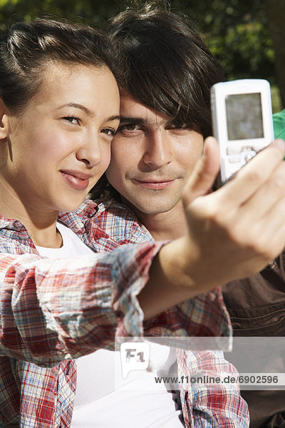Couple Taking Photo with Camera Phone