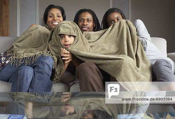Family Watching Television Together