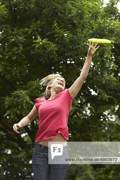 Woman Catching Frisbee