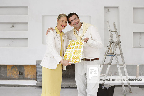 Portrait of Couple with Wallpaper Sample