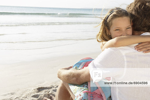 Girl Hugging Father on Beach  Majorca  Spain