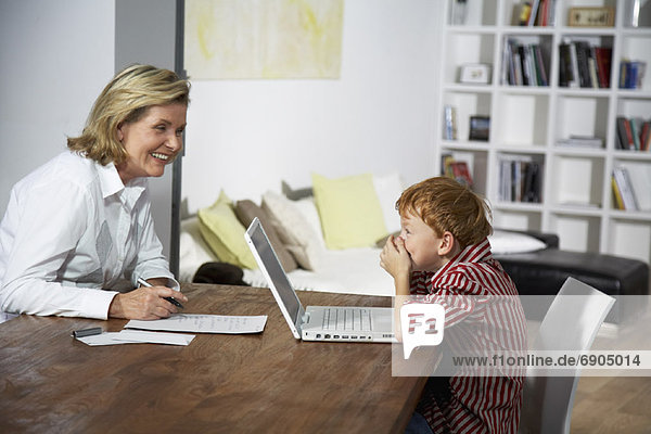 Grandmother and Grandson Using Laptop