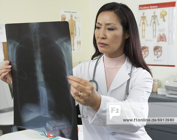 Doctor Looking at X-rays