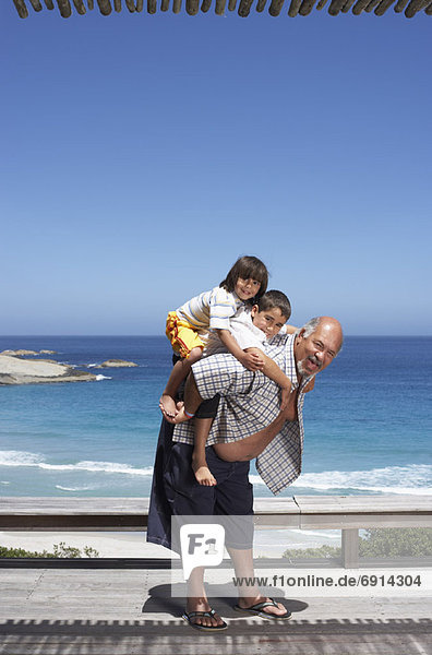 Portrait of Grandfather and Grandsons at the Beach