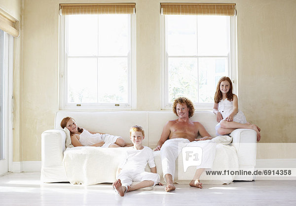 Portrait of Father and Children in Living Room
