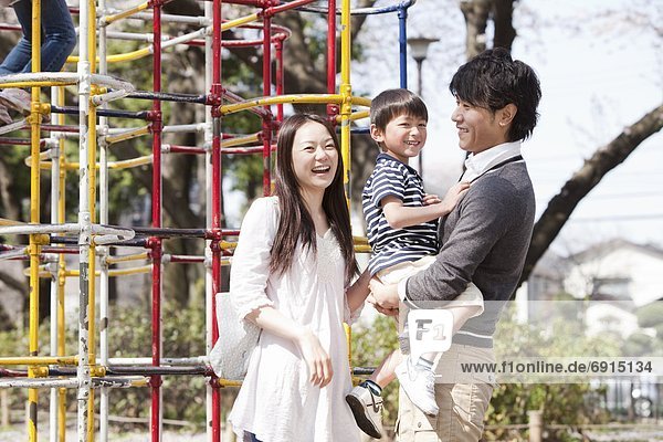 Parents and Son in Playground