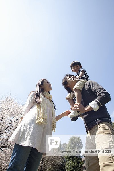 Family of Three  Son on Father's Shoulders